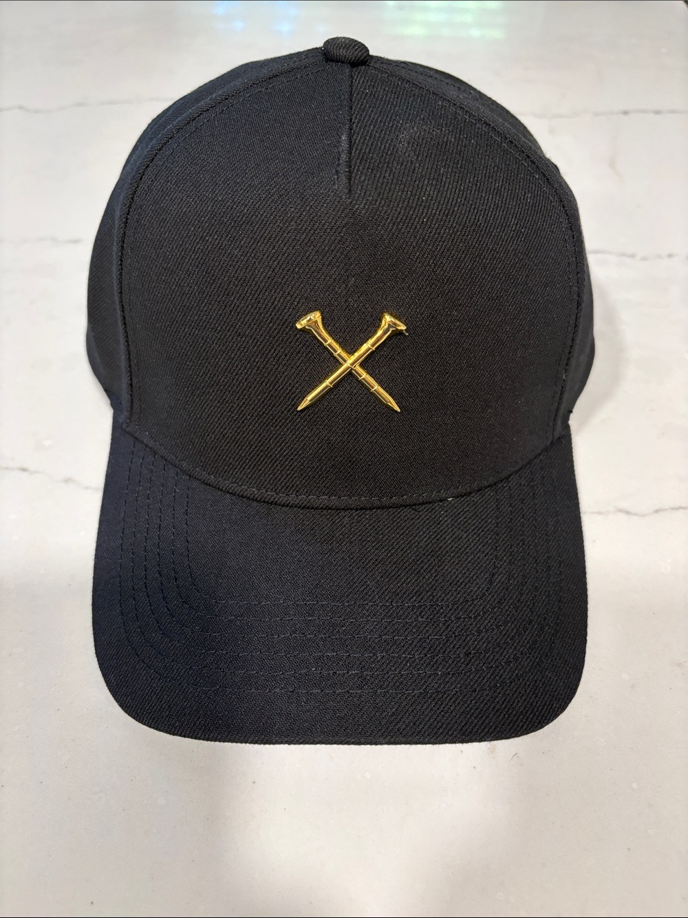 Black Golf hat with Gold Crossed Tees Emblem